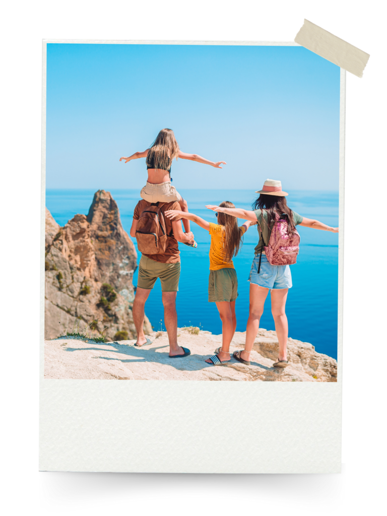 A family of travelers standing on a cliff overlooking the ocean, ready for their adventure.